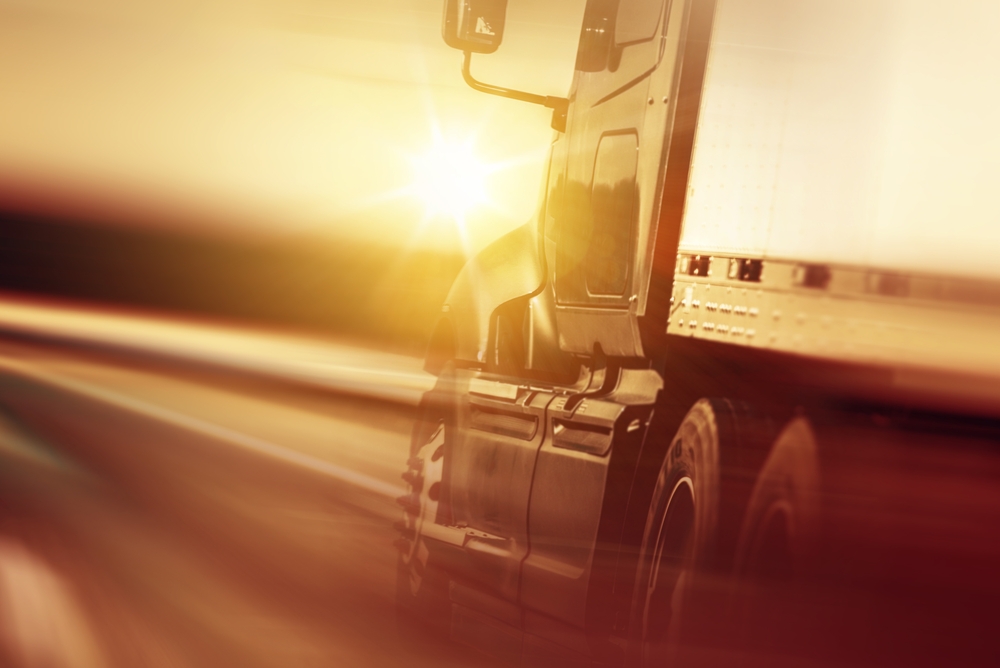 Steps to Take After a Truck Accident - Semi Truck In Motion. Speeding Truck on the Highway. Trucking Business Concept