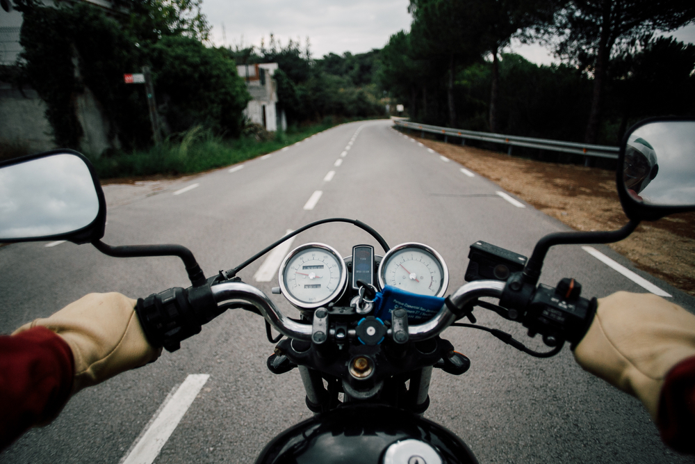 Safe Riding Tips to Ride By - Motorcycle handlebar POV on road highway