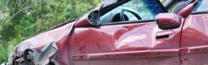 Dented driver door on car before calling an Accident Lawyer Watkinsville GA
