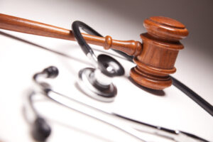 Gavel and stethoscope on the desk of a Catastrophic Injury Lawyer Watkinsville GA